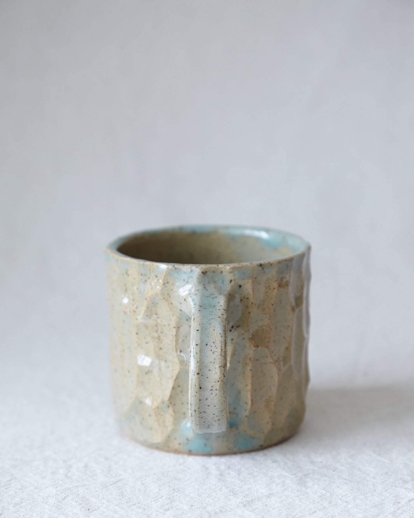 carved stoneware mug