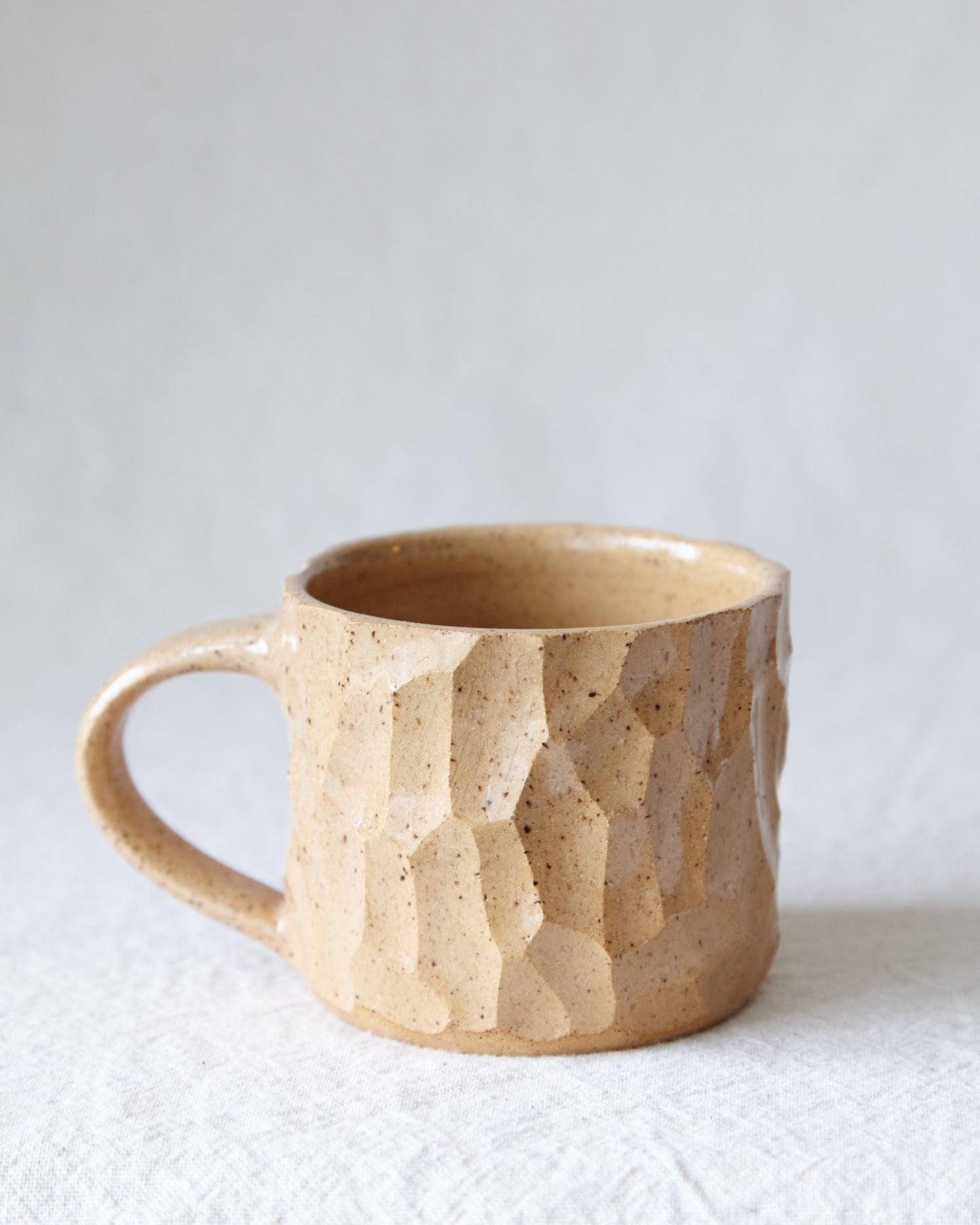 carved stoneware mug