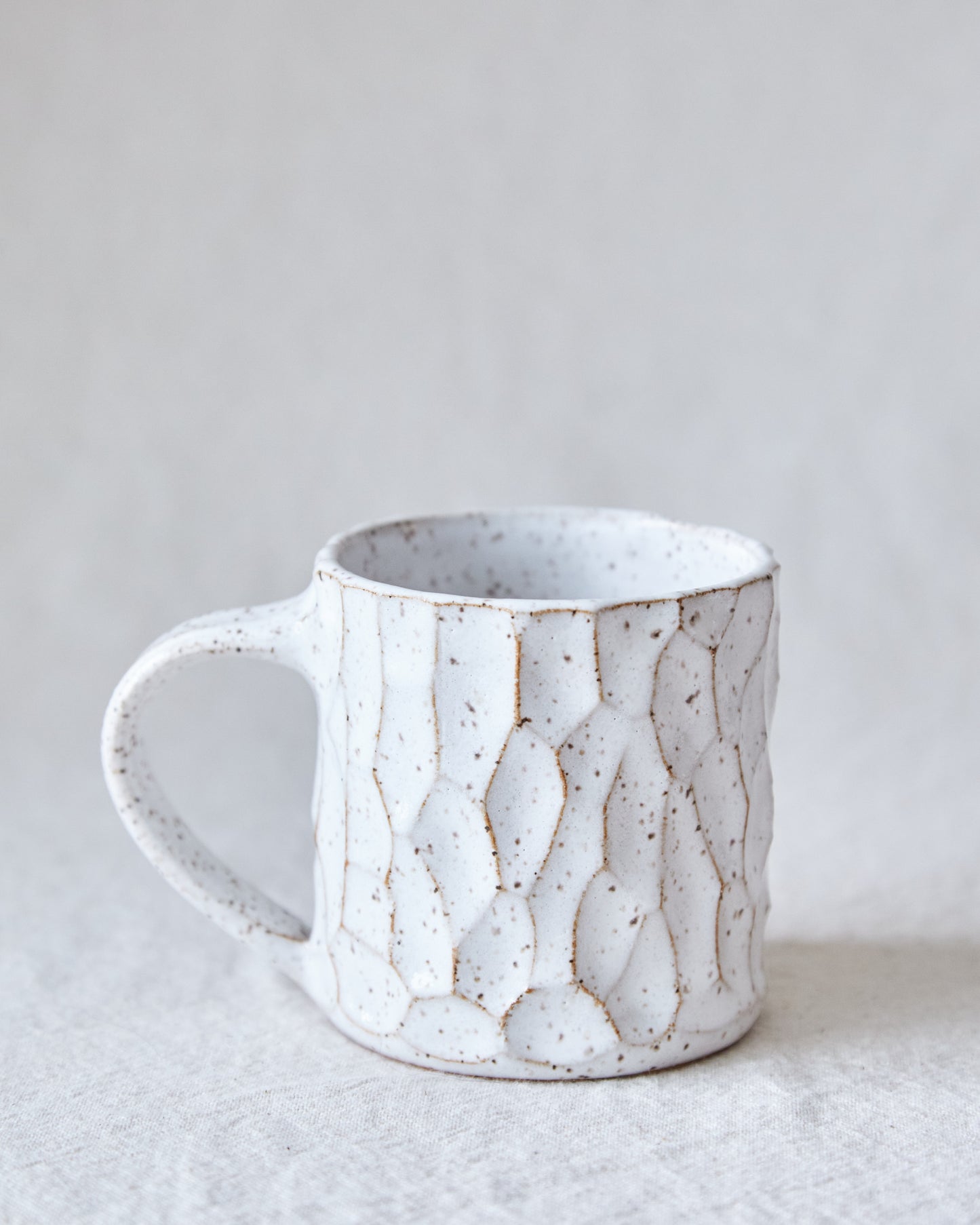 carved stoneware mug