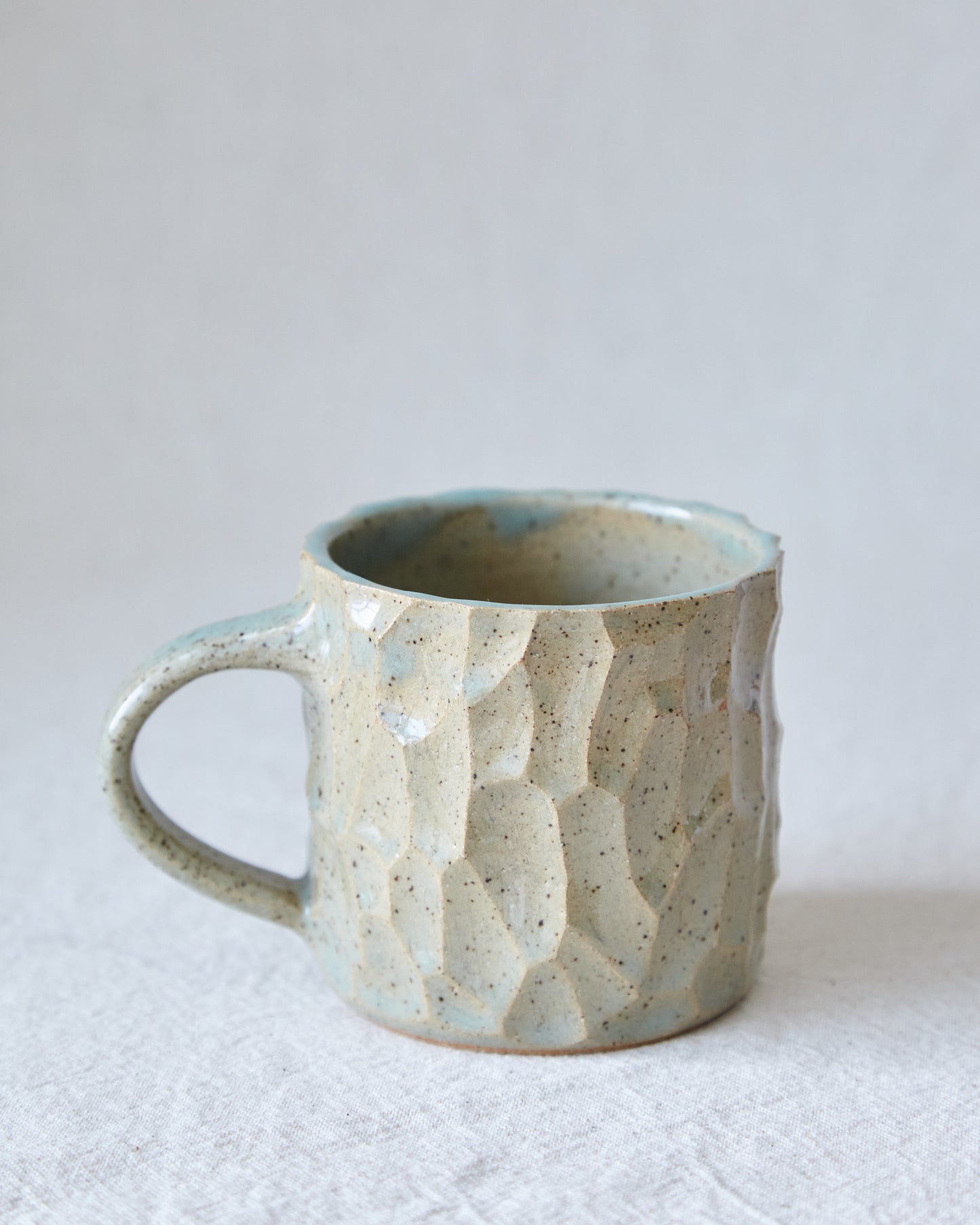 carved stoneware mug